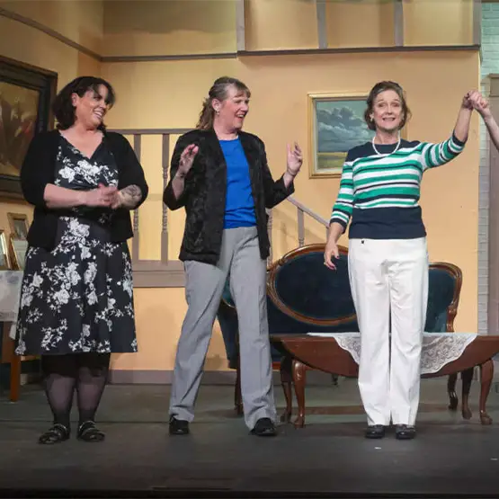 actors bowing on stage