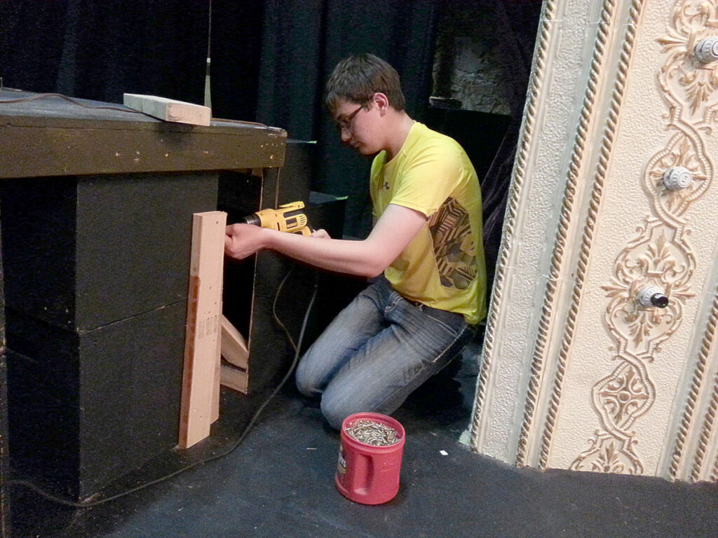 Jacob working on the set.  It's all about the power tools.