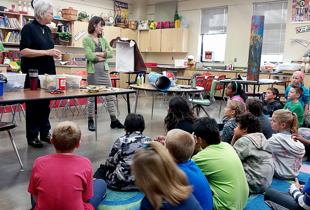 Artist, Cheryl Halsey (L), and Ava Sauter, with Ms. Haugland's 4th grade class