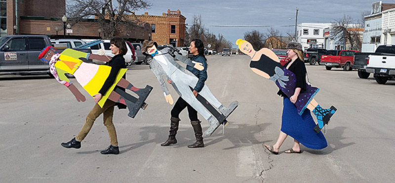 Transporting flat people to the library. Our very own "Abbey Road" moment.