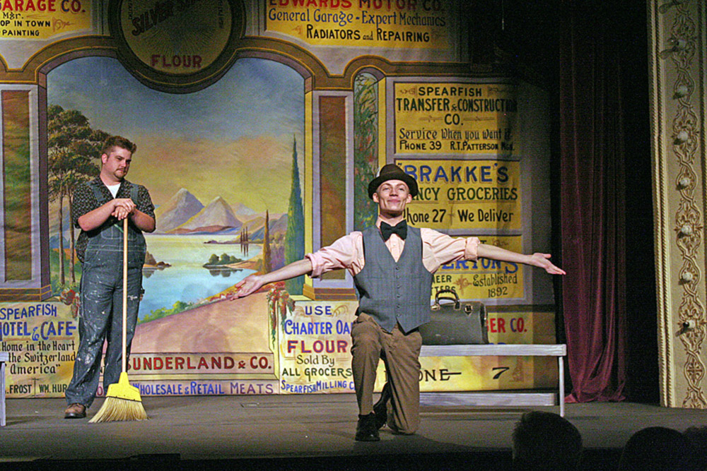 TYTUS SPIVEY as Buster (maintenance man) and KYLE GRAVES as Reporter Peter Pen