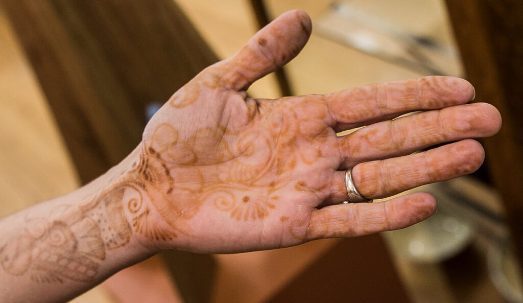 Henna tatooing.