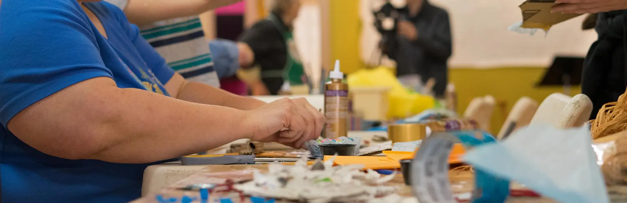 people working on arts at table
